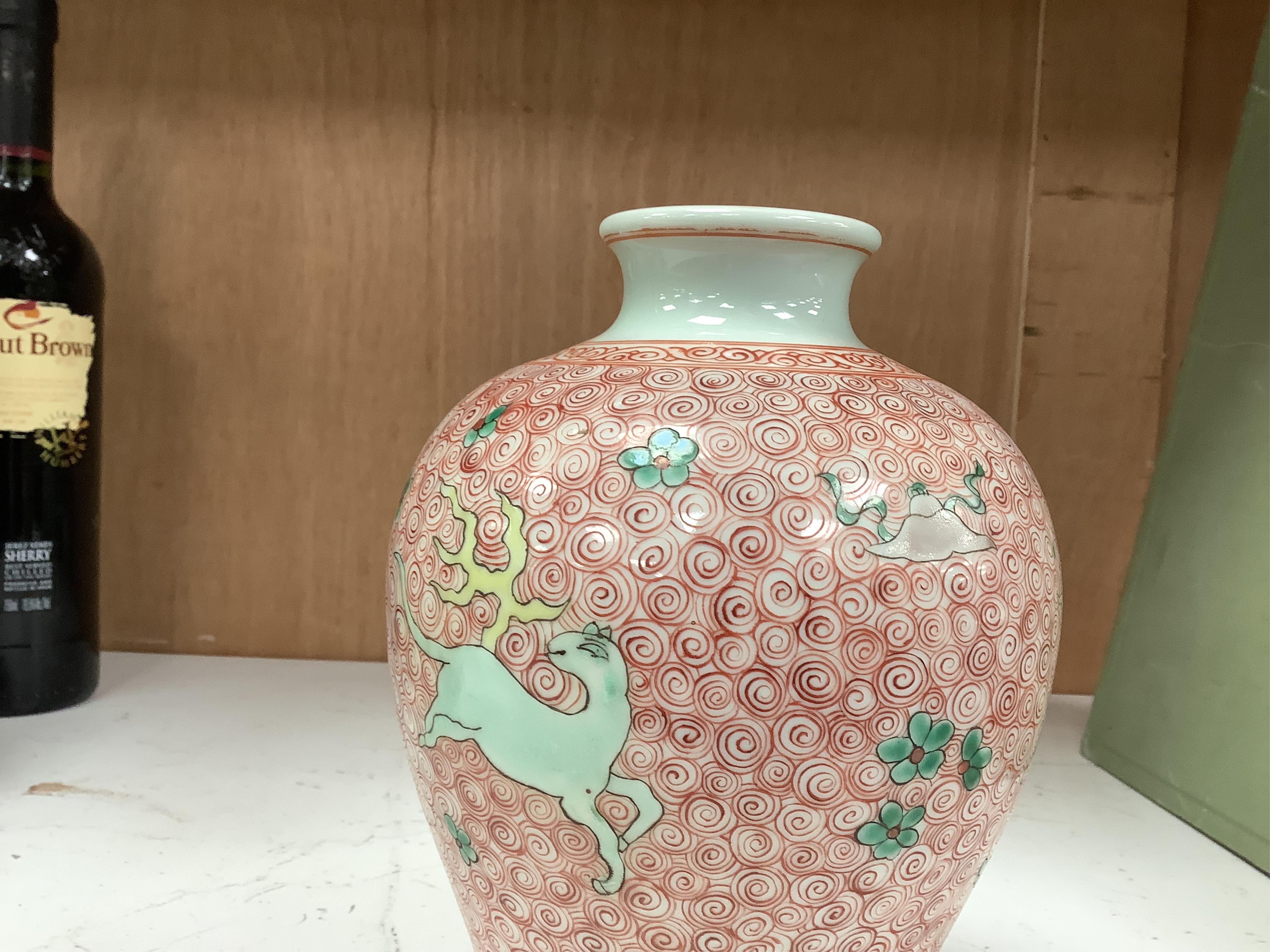 A Chinese famille verte jar, 19cm high. Condition - good